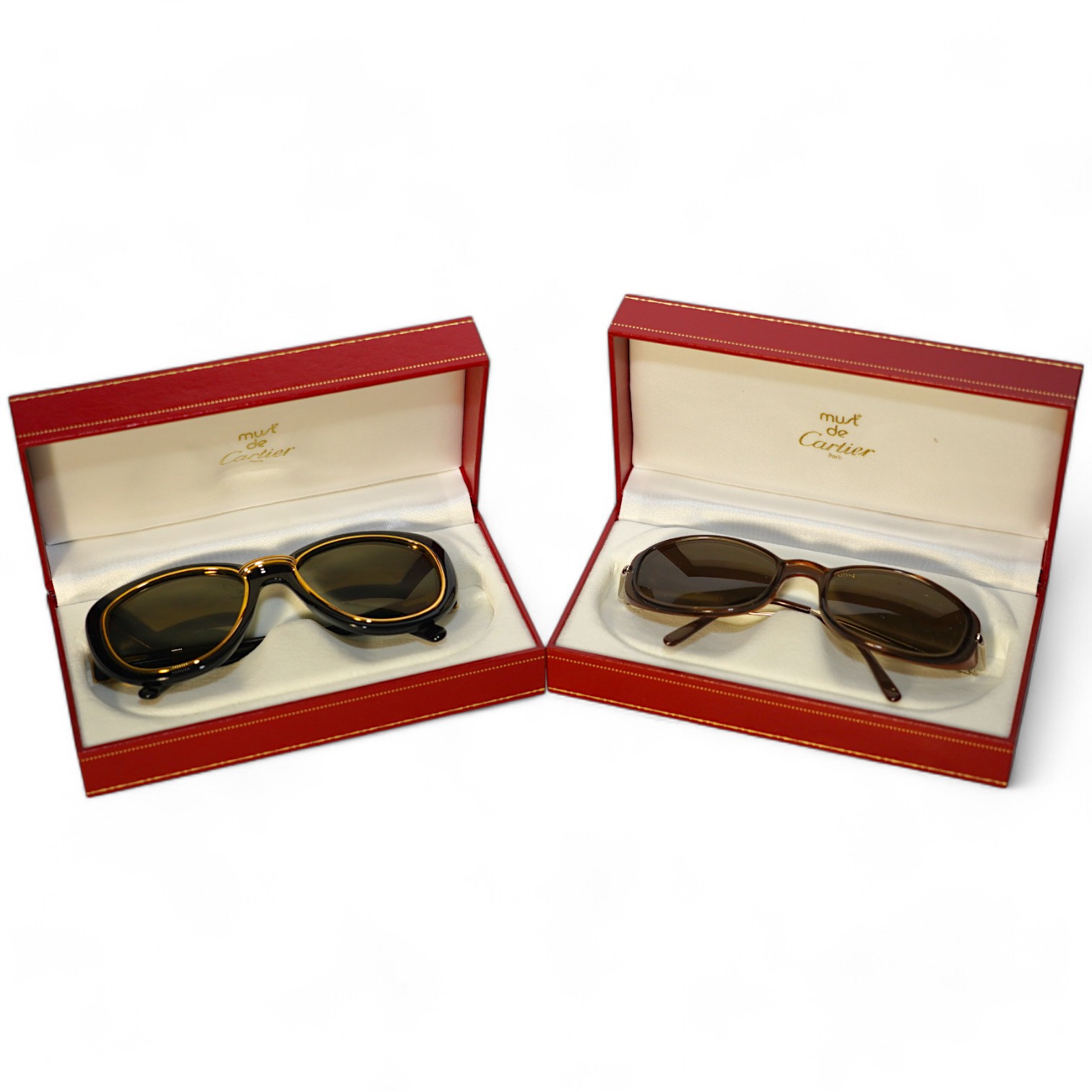 Two pairs of Must de Cartier sunglasses